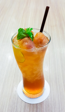 ice lemon tea on wood table background, low apertureの写真素材