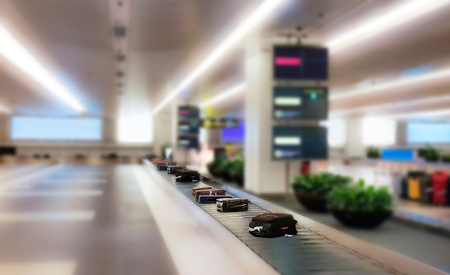 Luggage on the track blur background in airport low aperture blur backgroundの写真素材