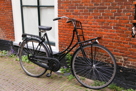 A bike and a brick wallの写真素材