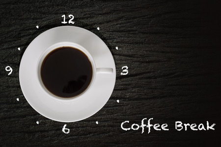 Cup of coffee the handle of which points to 3 pm. Coffee break conceptの写真素材