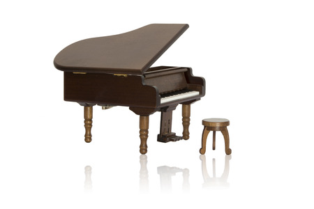 Model of wooden piano and its reflection isolated on white backgroundの写真素材