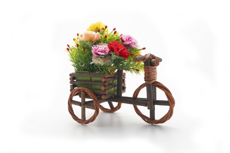 decorative wooden wheelbarrow with artificial flowersの写真素材