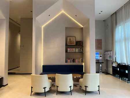 Interior of a modern cafe with bookshelves.