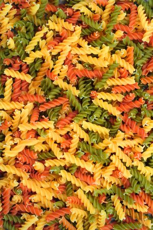 Top view of colorful twisted pasta piecesの写真素材