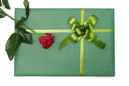 Top view of an isolated green gift box with red roseの写真素材