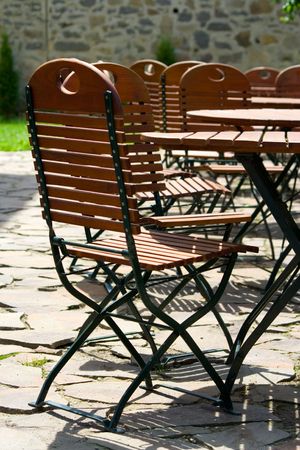 Empty charirs and tables in beer gardenの写真素材