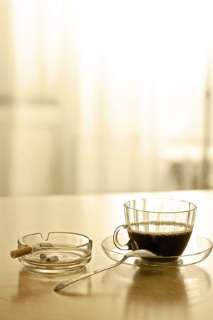 Coffee break and smoking a cigarette [in sepia tone]の写真素材