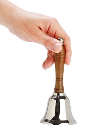 Hand holding shiny tinkle with wooden handleの写真素材