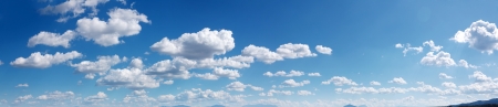 Wide sky panorama with scattered cumulus cloudsの写真素材