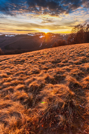 Sunset on the hill in dry winterの写真素材