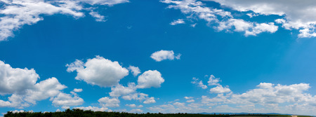 Wide sky panorama with scattered cumulus cloudsの写真素材