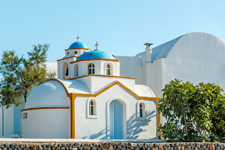 Tiny Greek church with blue dome on Santoriniの写真素材