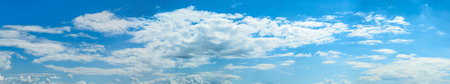 Wide sky panorama with scattered cumulus cloudsの写真素材