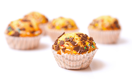 Delicious muffins with chocolate and candyの写真素材