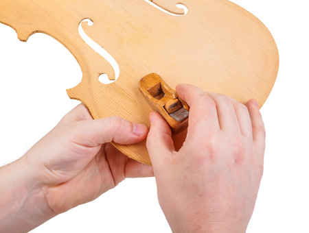 Luthier showing the usage of small hand planeの写真素材