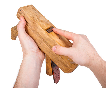 Woodworker showing the blade of the hand plane