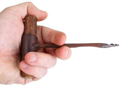 Vintage wooden drill in hand isolated Vintage wooden drill in hand isolated