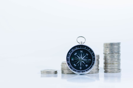 Way to Investment to Growing Money, Stacking Coin with Compass on White Backgroundの写真素材