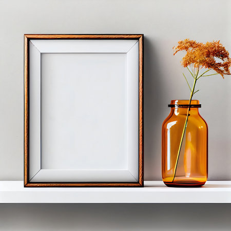 The image is a mock-up of a frame placed on a wooden shelf against a wall. The frame is empty, providing ample copy space for the placement of artwork, pictures, prints, or posters.の素材