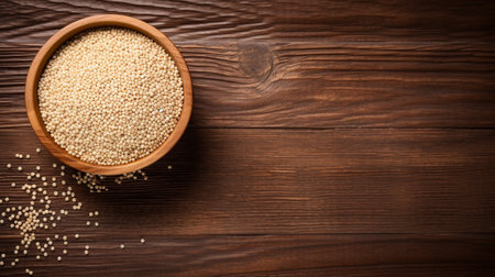 a Quinoa grain, beautifully illuminated using studio lighting against a textured wood background. The composition provides ample copy space for your creative designs or messagesの素材