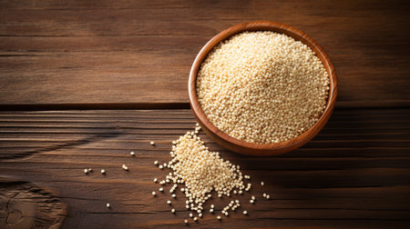 a Quinoa grain, beautifully illuminated using studio lighting against a textured wood background. The composition provides ample copy space for your creative designs or messagesの素材