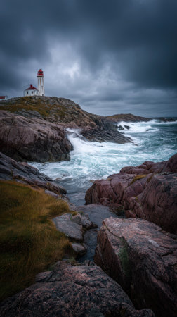 An old lighthouse on rocky coast with stormy sky, dramatic waves, rugged landscape, moody atmosphの素材