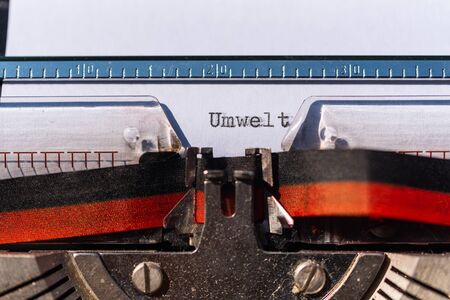 Typewriter with a sheet and the text Umwelt  (Environment)