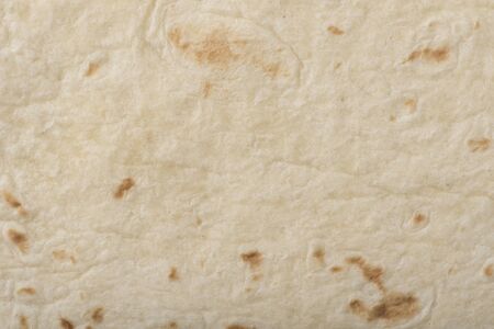 Closeup texture of a flour tortilla.