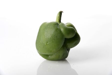 A Deformed or Imperfect Green Pepper Standing Uprightの写真素材