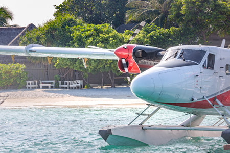 Exotic scene with seaplane on Maldives sea landing. Vacation or holiday in Maldives concept backgroundの写真素材