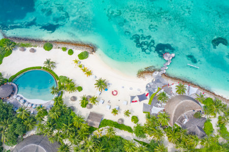 Aerial photo of beautiful paradise Maldives tropical beach on island. Summer holiday, travel vacation concept. Luxury resort, wonderful aerial landscape, amazing beach palm treesの写真素材