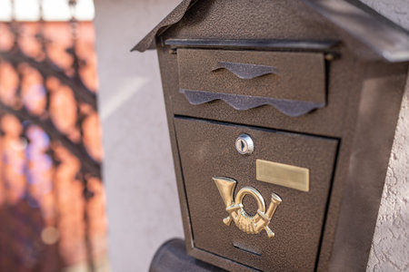 Modern metal mail box on brick stone wall