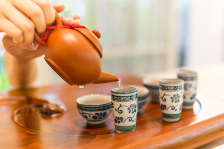 Asian tea set on bamboo wooden background. Traditional Chinese tea ceremony accessories on the tea tableの写真素材