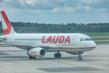 Schwechat, Austria, May 07. 2019, Lauda motion Airbus A320 aircraft landing at vienna international airport. Low cost airlineのeditorial素材