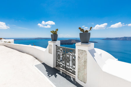 Santorini Island, Greece. Amazing white architecture, blue sky and relaxing summer mood. Vibes, travel and vacation background. Beautiful summer holiday sceneryの写真素材