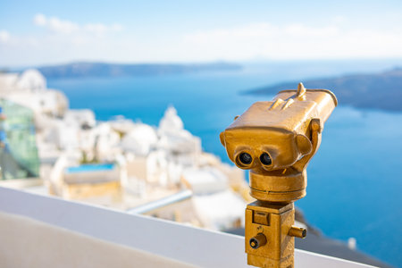Travel tourism in Europe holiday walking in Santorini city street looking through tower viewers,...
