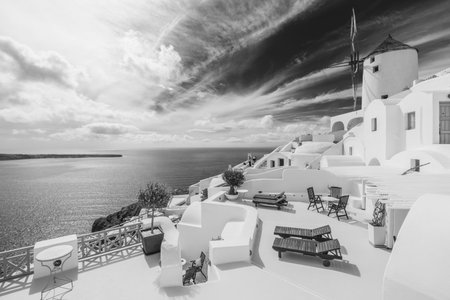 Santorini Greece process in dramatic black and white. Beautiful artistic image of Santorini white architecture as beautiful travel landscape.の写真素材