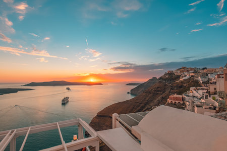 Fantastic evening view of Santorini island. Picturesque spring sunset on famous view Fira, Greece, Europe. Traveling concept background. Sunset landscape, luxury travelの写真素材