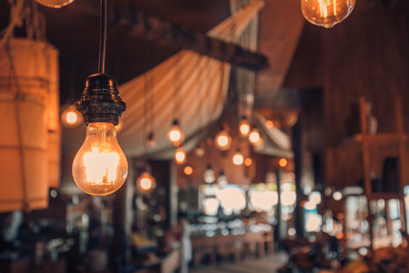 Vintage lamp decorative in restaurant, warm bulb light. Light lamp electricity hanging decorate hotel or home interiorの写真素材