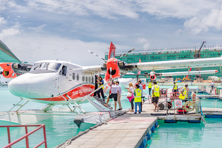Passengers are boarding seaplane at Male, Maldives. Transmaldivian airways, world largest seaplane company. Travel in Maldivesのeditorial素材