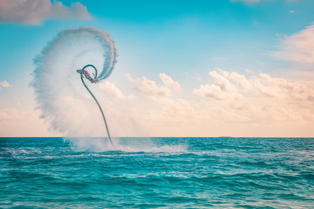 Professional pro fly board rider in tropical sea, water sports concept background. Summer vacation fun outdoor sport and recreationの写真素材