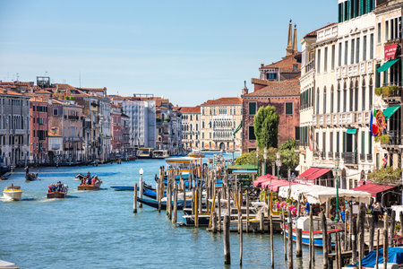 Streets of the ancient city. Beautiful view of traditional gondola and boats on canal grande. Summer vacation and travel tourism scenery. Sunny weather Venice, Italy: 22.09.21のeditorial素材