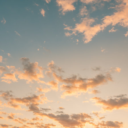 Beautiful sunset sky with clouds. Nature background. Toned.の写真素材