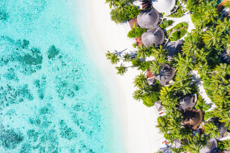 Summer aerial landscape, luxury tropical resort or hotel with water villas and beautiful beach scenery. Amazing bird eyes view in Maldives, landscape seascape aerial viewの写真素材