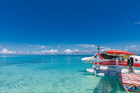 Exotic scene with seaplane on Maldives sea. Amazing travel background in exotic destination. Vacation or holiday in Maldives concept background 10.24.21 - Ari Atoll, Maldivesのeditorial素材