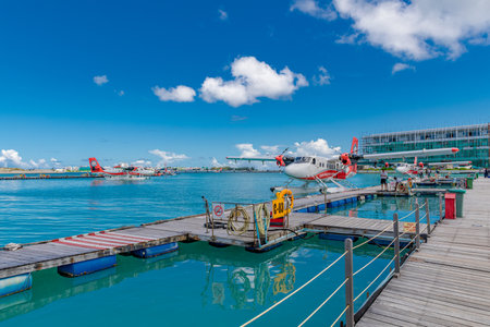 Trans Maldivian Airways Twin Otter seaplanes at Male airport (MLE) in the Maldives. Seaplane parking next to floating dock wooden pier, Maldives. Male, Maldives â May 10, 21のeditorial素材