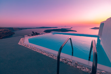 Beautiful poolside and sunset sky. Luxurious resort hotel tranquil fantastic landscape, infinity swimming pool romantic sunset in summer vacation destination. Luxury travel holidayの写真素材