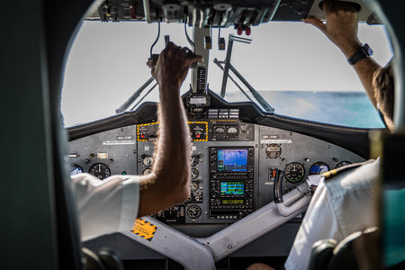 Maldives: Pilot copilot in commercial plane in cockpit, Pilot operation with control panels and navigation. Flying with plane, pilot view. Transportation and technology. 12.09.21のeditorial素材
