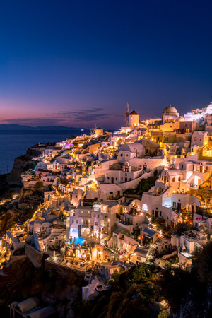 Amazing evening view of Santorini island. Picturesque spring sunset on the famous Oia village, Greece, Europe. Traveling. Artistic inspire sunset landscape, dream vacationの写真素材