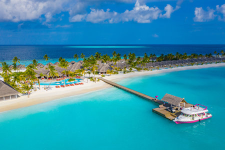 Maldives paradise shore. Tropical aerial landscape, seascape, water villas pier bridge amazing sea...